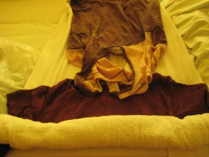 img_44071 7. Lay clothing on a towel and roll the towel over them.
