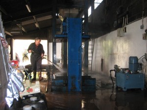 IMG_8002 Mr. Wilkins spraying down the apple pressing room
