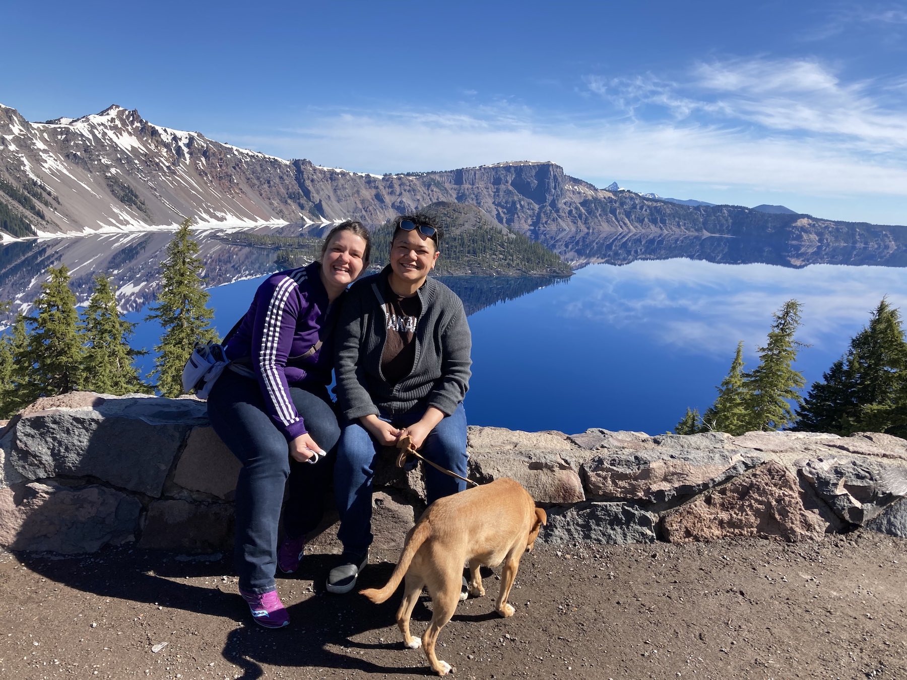 Charity, Maylene, and Alys at a scenic outlook with the breathtakingly beautiful Crater Lake, Oregon, in the backgound